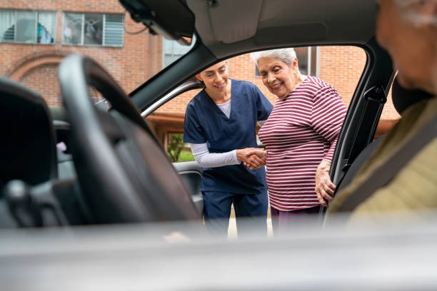 imageye imgi 46 home caregiver helping a senior woman get in a car